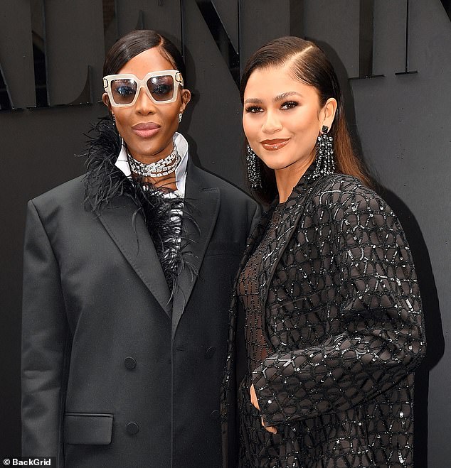 Stunning: The model, 52, (left) accessorised with an oversized pair of sunglasses, a dazzling diamond necklace and a chic handbag as she posed beside Zendaya (right)