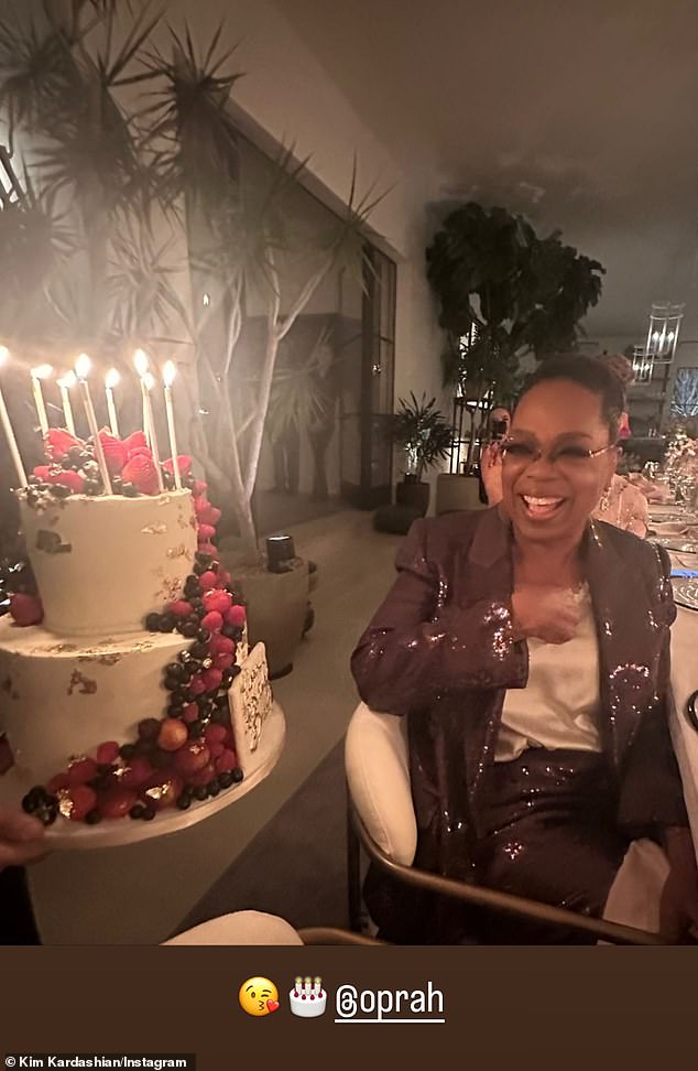 Birthday girl: Kim also took to her Stories to share a snap of Oprah as she received a birthday cake at the bash, which took place the night before her actual birthday