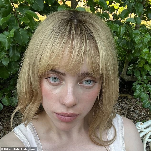 Natural: She shared two close-up front selfies, posing with very little makeup as she let her natural beauty shine