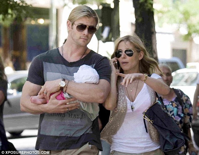 Over there: While Chris was in charge of carrying baby India, Elsa directed the family around Madrid for their excursion