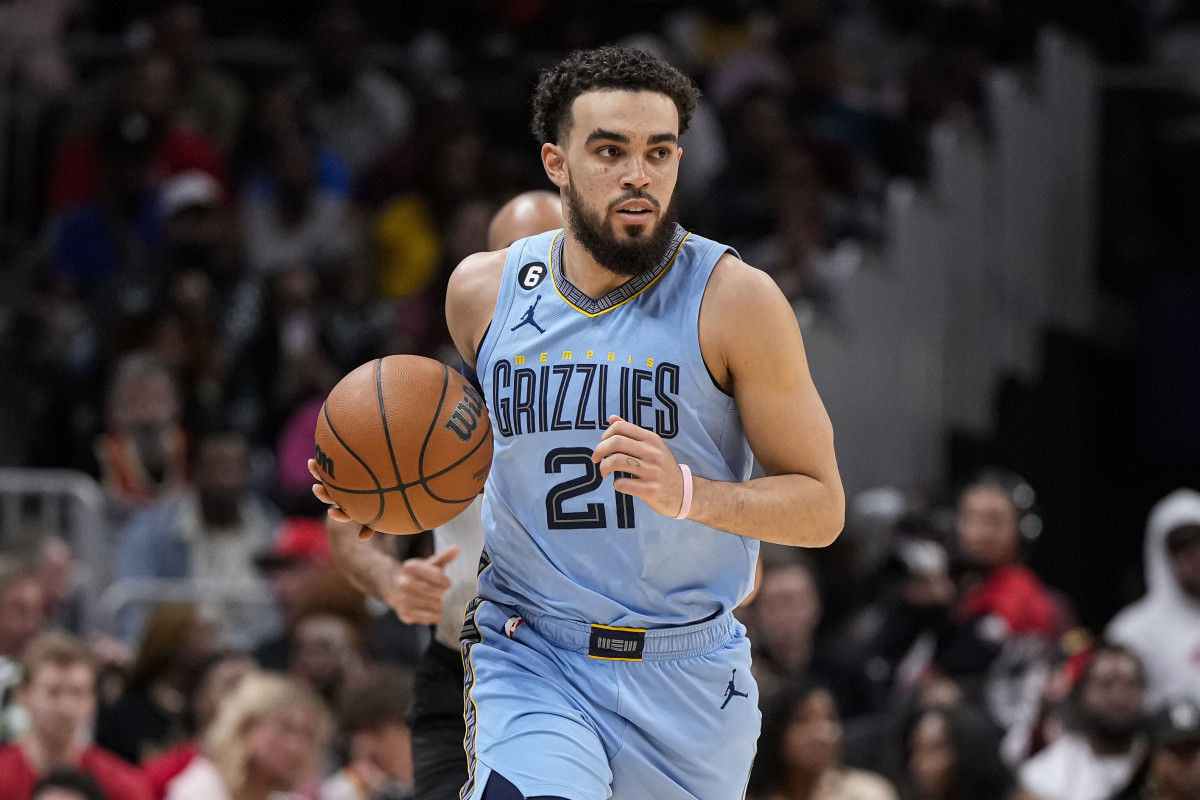 Mar 26, 2023; Atlanta, Georgia, USA; Memphis Grizzlies guard Tyus Jones (21) controls the ball against the Atlanta Hawks during the second half at State Farm Arena.